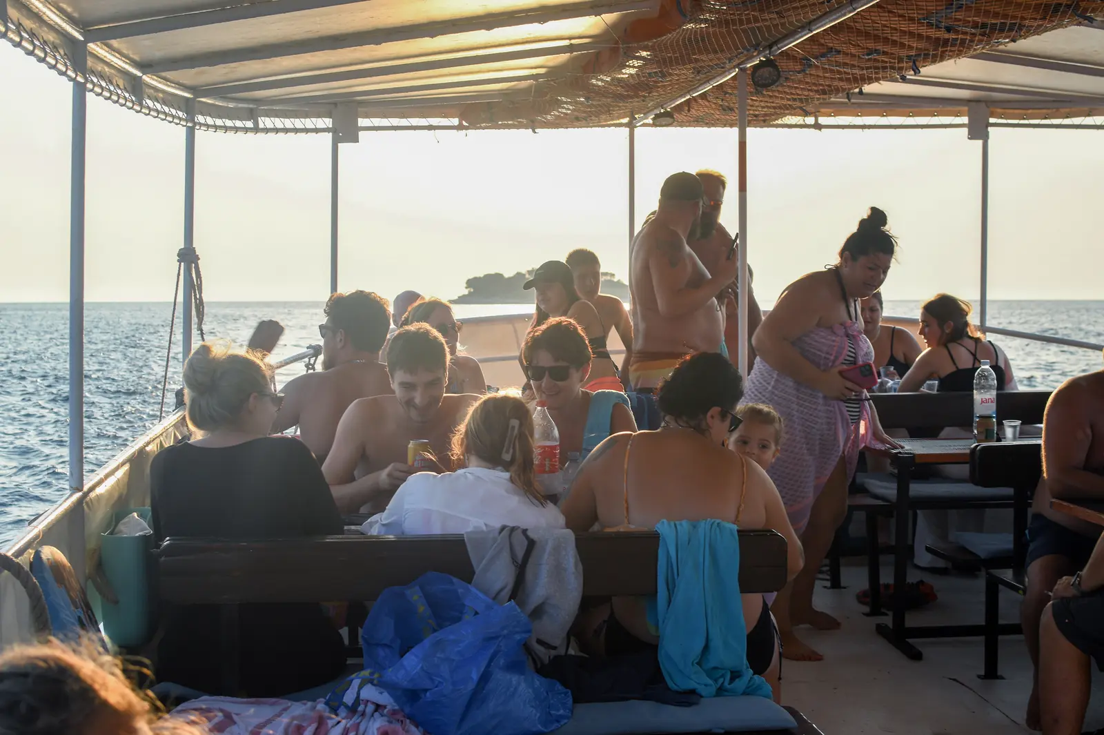 Koralj full of guests at golden hour